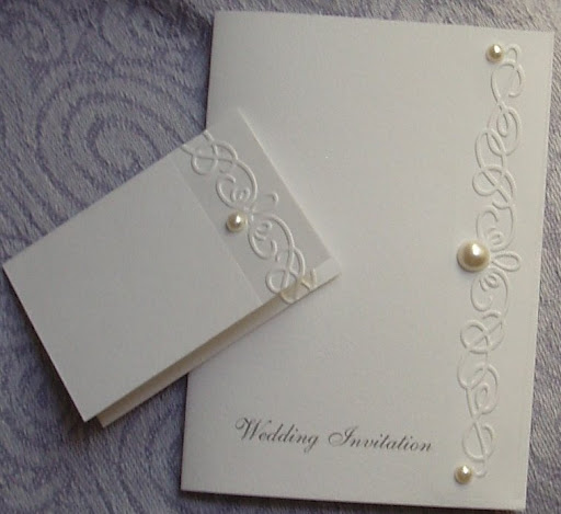 Elegant Swirls and Pearls Hand Embossed Wedding invitations on a Soft Velvet