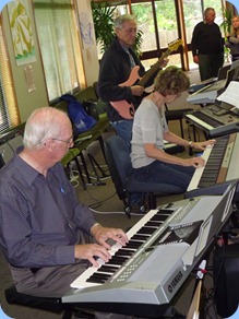 Peter Brophy (foreground) harmonizing with Denise and Brian Gunson
