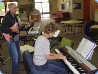 Denise Gunson playing Peter Brophy's Korg SP-250 digital piano with husband, Brian, accompanying on guitar.