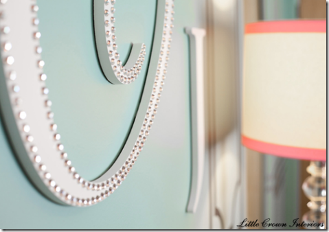 wooden wall monogram nailhead detail