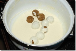 Dipping green gram balls in the batter before frying