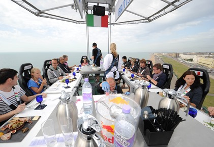 BRIGHTON – AUGUST 22 ; British Airways’ competition winners pose for pictures /  dine in the sky in a 100ft high pop up restaurant during the #BABeachside event at Hove Lawns on August 22, 2013 in Brighton, England.

( Photo by Stuart Wilson – Getty Images for British Airways)