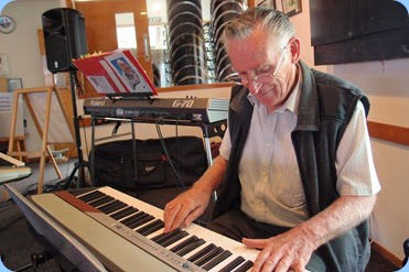 Roy Steen playing the Club's Korg SP-250 digital piano. Photo courtesy of Dennis Lyons