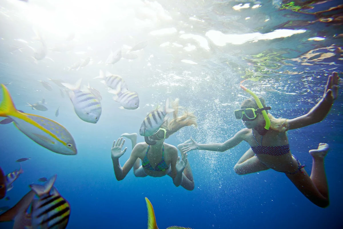 Curacao-snorkeling-girls - Kids and adults love the underwater sights while snorkeling in Curacao.