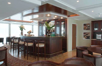 Guests can unwind after a day of sightseeing along the rivers of western Europe with a cocktail in the Panoramic Lounge Bar aboard AmaDagio.