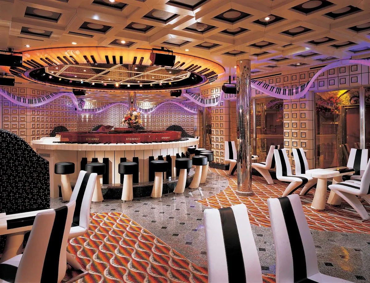 Carnival-Liberty-Piano-Man-bar - Pull up a seat, order a cocktail and let the friendly piano player know what songs you want to hear (or sing along to) at Carnival Liberty's Piano Man piano bar.