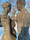 Skulptur Mann und schwangere Frau