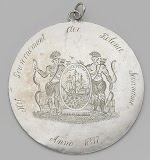 Penning geschonken aan slaaf George wegens bewezen trouw tijdens de onrusten te Nickerie. Suriname, 1837