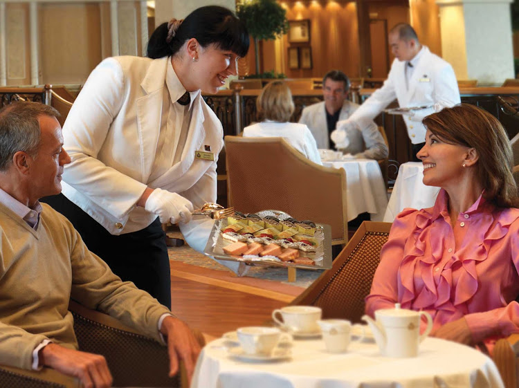 Enjoy a cup of soothing afternoon tea while cruising aboard Queen Elizabeth.