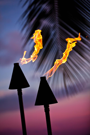 Tiki torches at dusk in Waikiki, Oahu.
