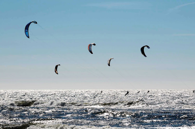 Kite surfers along the beach in Zandvoort, west of Amsterdam in the Netherlands.