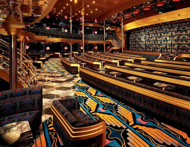 Catch Vegas-style shows, big-screen movies, talks and game shows at the Blue Sapphire Lounge, Carnival Ecstasy's main theater.