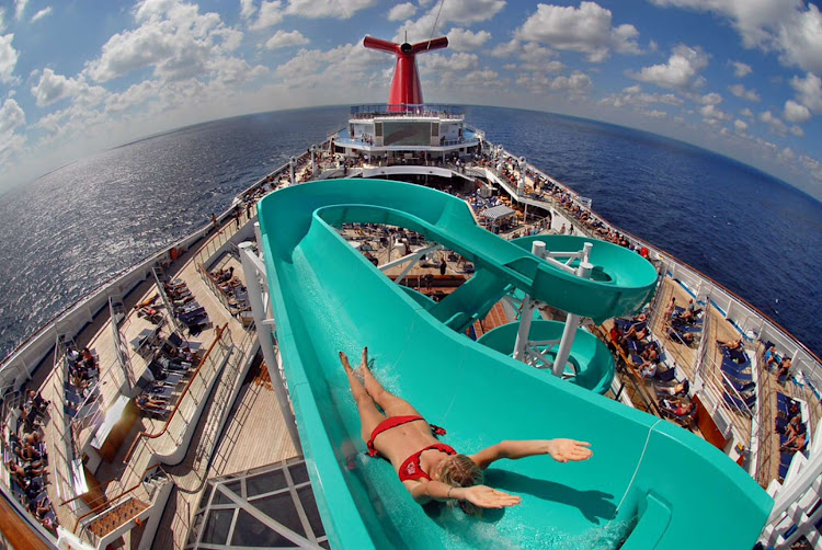 Freedom to slide: A girl takes off from the top of the wickedly fun slide on the Lido deck of Carnival Freedom.