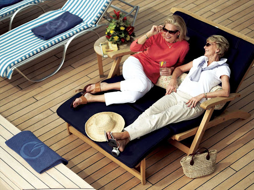 Chat up a friend and enjoy refreshments at poolside during your sailing on Oceania Insignia