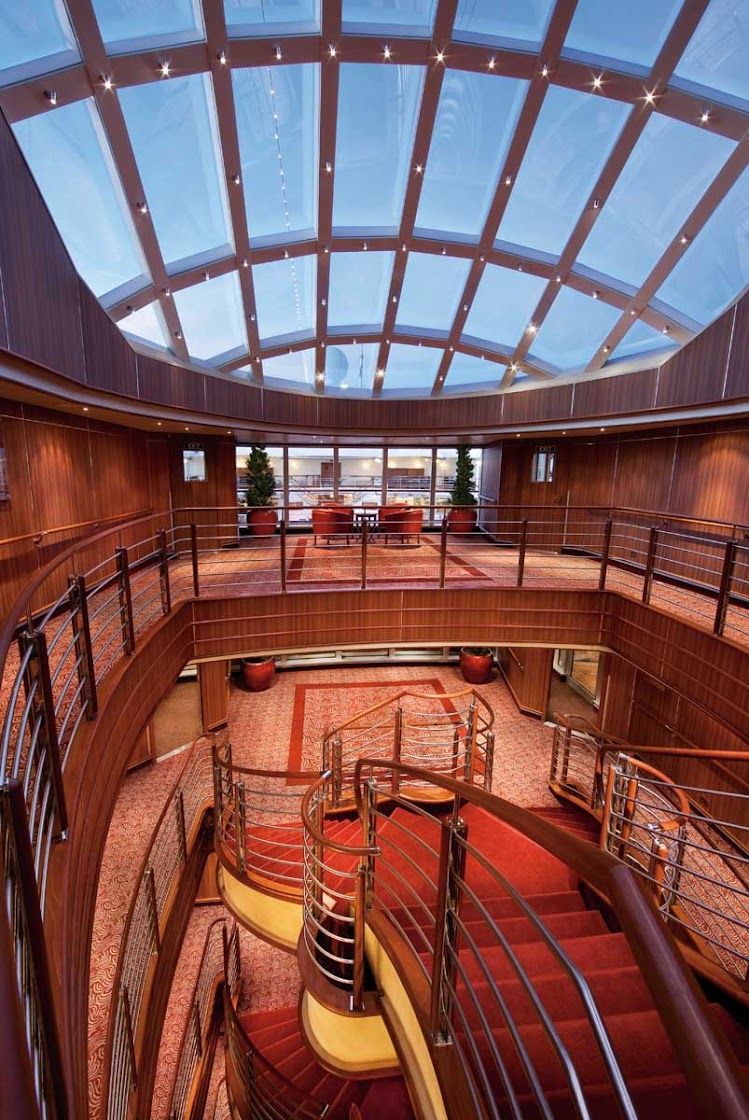 A view from the top of the grand staircase in the atrium aboard Silver Spirit. Thet stairway will transport you from the Observation Deck to the Restaurant.