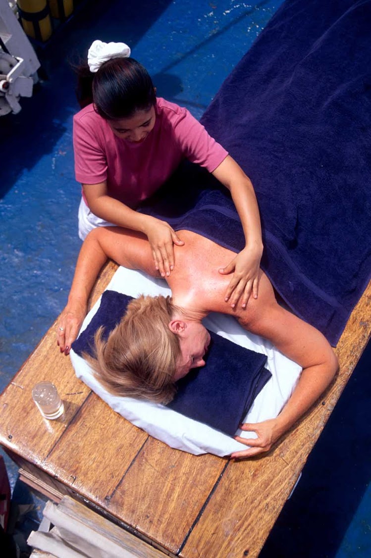 Sign up for a restorative massage in a semi-private setting on your Star Clipper cruise ship's top deck.