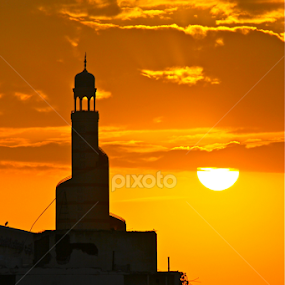 The Fanar minaret silhouetted against the sunset sky by Nashira Usef - Buildings & Architecture Places of Worship