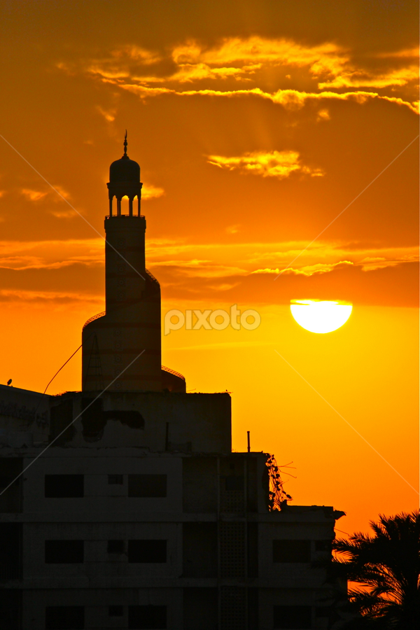 The Fanar minaret silhouetted against the sunset sky by Nashira Usef - Buildings & Architecture Places of Worship
