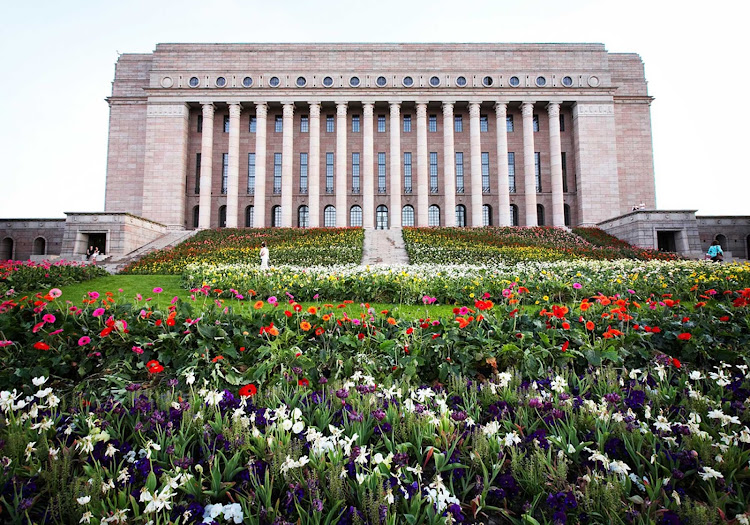 The massive stairs in front of the colossal Finnish parliament house were surrounded by 60,000 flowers for one week as an installation by artist Kaisa Salmi.