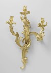 Wandarm van verguld brons met drie, uit asymmetrische C- en S-voluten opgebouwde armen