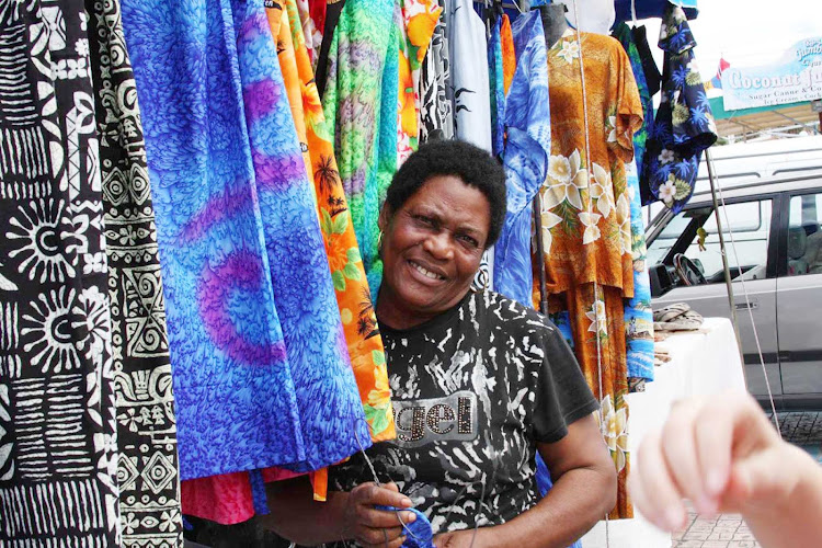 Selling textiles in St. Maarten in the Caribbean. 
 
