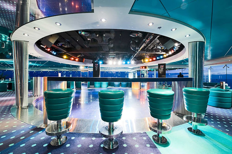 With its blue-green palette and wrap-around windows, MSC Lirica's Blue Club Disco is a captivating place to dance the night away.