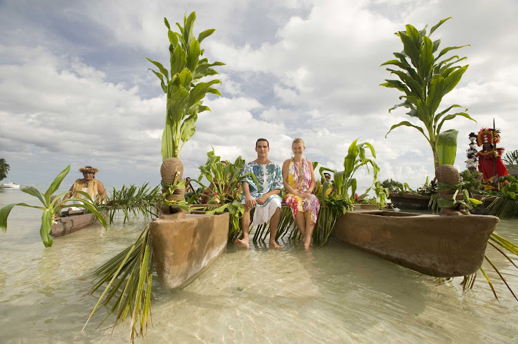 Visitors experience the traditions and lifestyle of an old Tahitian village on Mo'orea through demonstrations of weaving, stone carving, and painting.