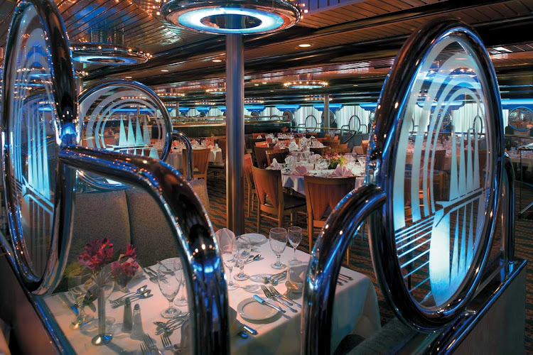 Sit down for a relaxing meal at the Wind Song restaurant, one of Carnival Ecstasy's main dining rooms.