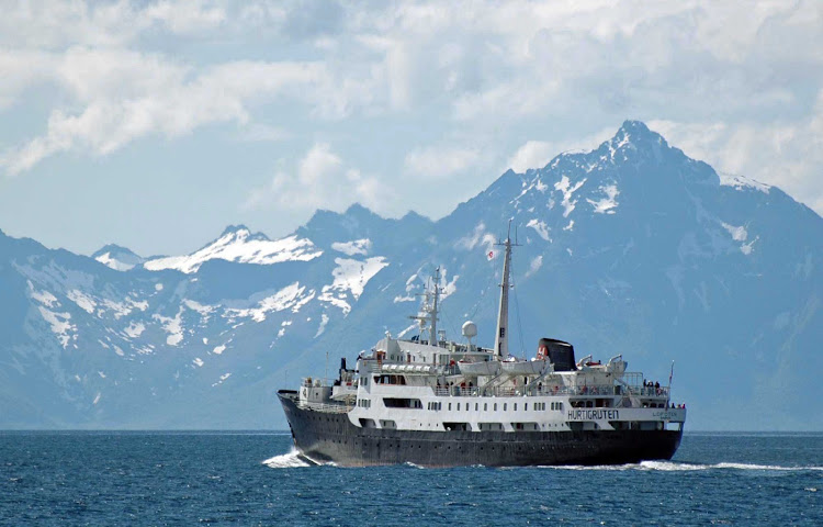 Explore the wild and natural Norwegian scenery as you travel through the Raftsund strait aboard Hurtigruten's Lofoten.
