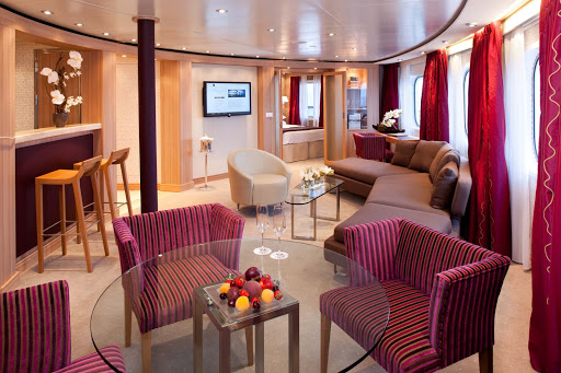 Seabourn_Odyssey_Sojourn_Quest_Owners_Suite - The Owners Suites on board Seabourn Odyssey are spacious, with a separate bedroom, a private and guest bathroom, dining for four, a full wet bar, and a full length window and door that opens onto the private veranda. This suite also offers complimentary wi-fi.