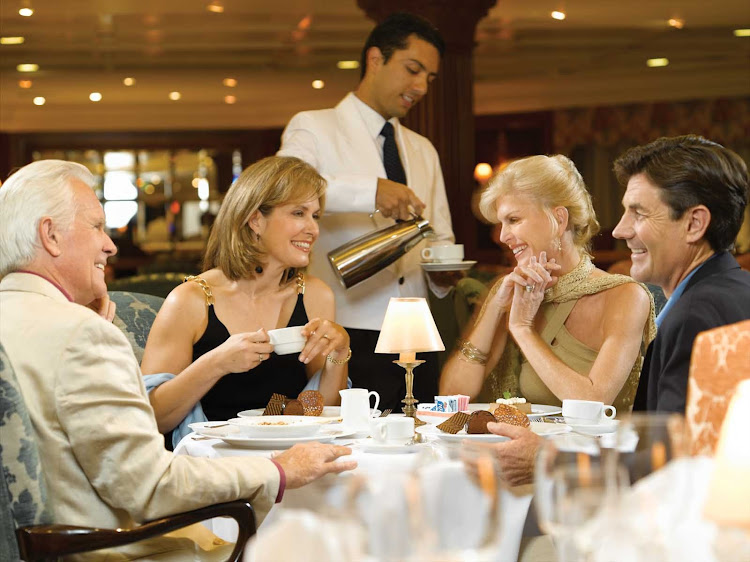 Oceania Insignia's luxurious Grand Dining room is the ideal setting to enjoy the company of new or old friends.