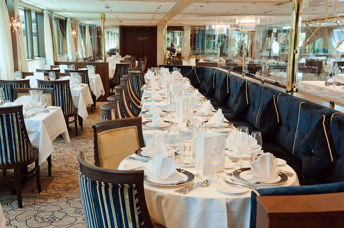 Tauck-InspirationClass-Compass-Rose - Compass Rose, the main dining room on Tauck's sister river cruise ships Inspire and Savor, boasts panoramic windows and a full menu service for dinner.  