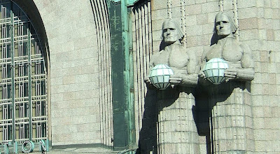 Lantern bearers on the Central Railway Station in Helsinki, Finland.