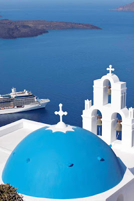 Celebrity Solstice will travel through the deep blue waters around the Greek Island of Santorini.