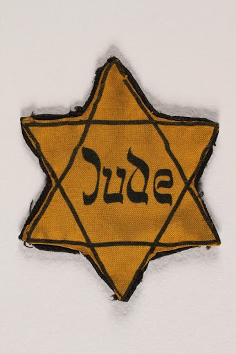 Star of David badge printed with Jude worn by a German Jew — Google ...