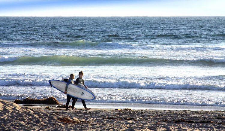 Surfers on Mission Beach, San Diego.