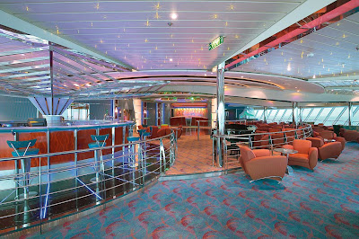 Have a drink or make new friends at the disco-style Vortex Bar aboard Jewel of the Seas.