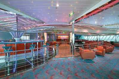 Have a drink or make new friends at the disco-style Vortex Bar aboard Jewel of the Seas.