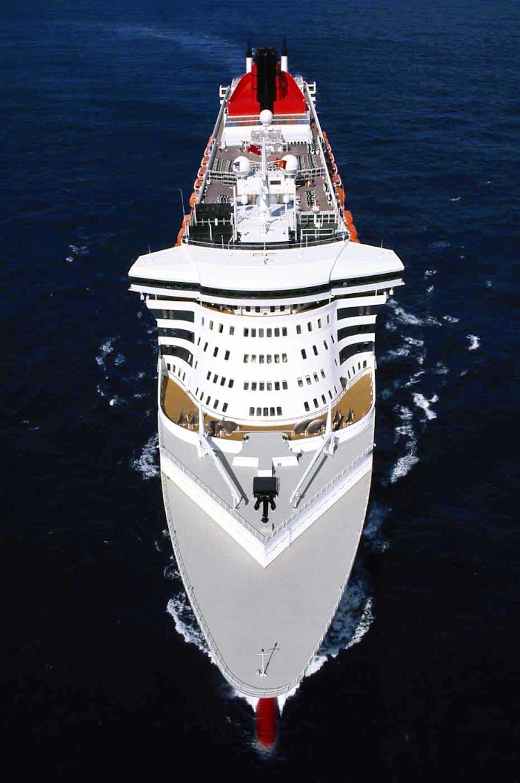 The bow and top view of Queen Mary 2. No water slides or hairy chest contests, just elegant cruising aboard a classic ocean liner.