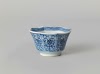 Octagonal cup with flower scrolls in panel decoration