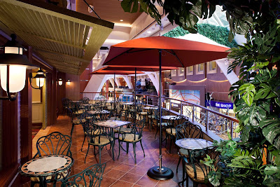 Catch the view out on the terrace in the Diamond Club aboard Allure of the Seas. The cozy retreat offers exclusive 24-hour access for Diamond, Diamond Plus and Pinnacle members.