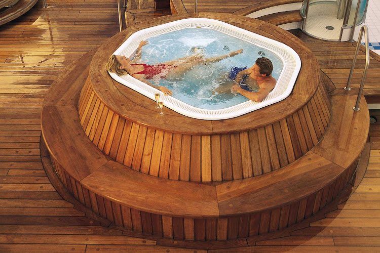 Head to the top deck of Seven Seas Navigator and relax in the heated whirlpools.