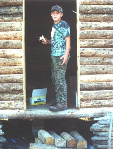 [Building the cabin - Tyler in door[5].jpg]