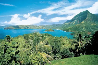 Paul Gauguin guests can hike to take in this view of the Marquesas' sun-kissed mountains and untouched wilderness.