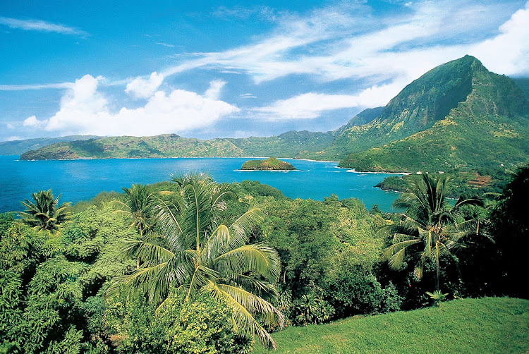 Paul Gauguin guests can hike to take in this view of the Marquesas' sun-kissed mountains and untouched wilderness.