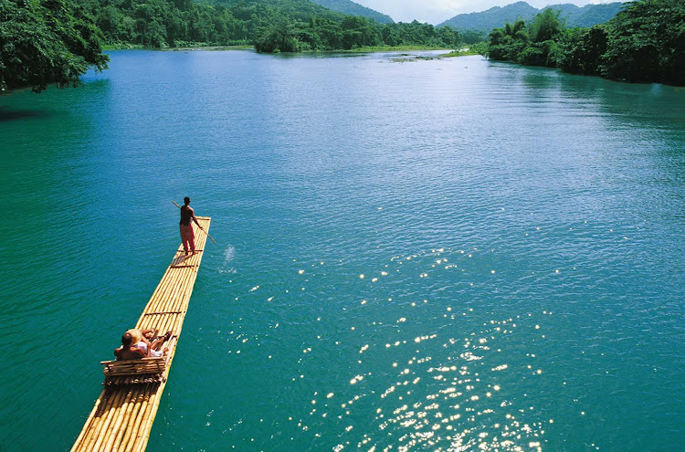 A guide takes guests on a scenic tour of one of Jamaica's inland waterways. 