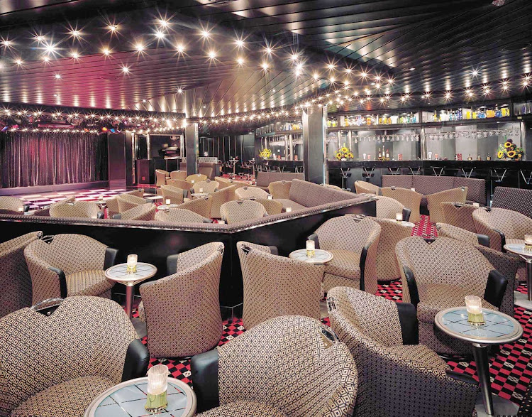 Be entertained with cabaret performances while drinking and dining at Norwegian Sky's Dazzles Nightclub.