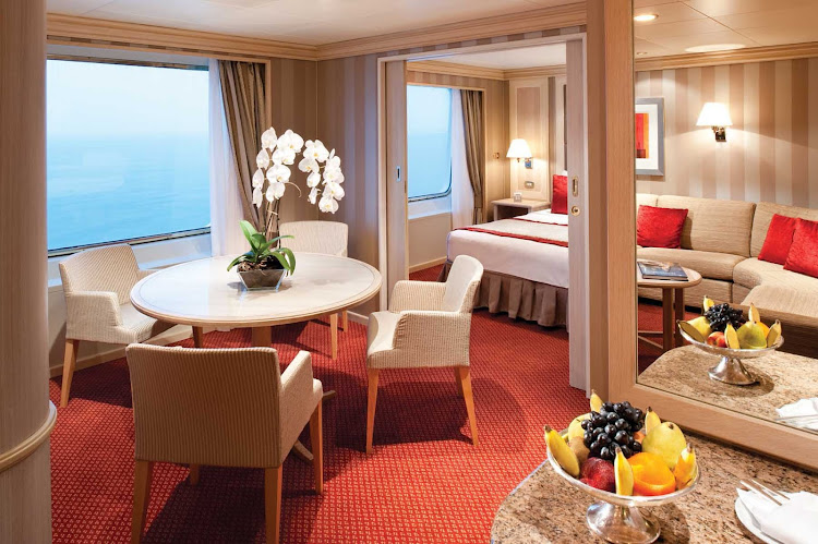 Silver Wind's Medallion Suite offers guests a spacious living room space with large windows, affording panoramic ocean views.