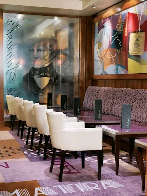 Try a glass of fine wine or a cappuccino and fresh baked pastries at Sir Samuel's wine bar aboard Queen Mary 2.