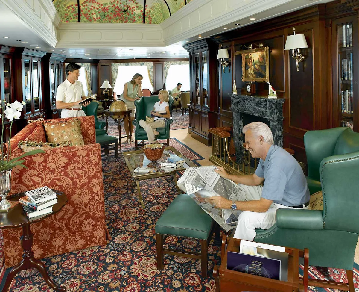 Oceania-Library-1 - During your cruise on Oceania Regatta, kick back and catch up on your reading in the ship's Library.